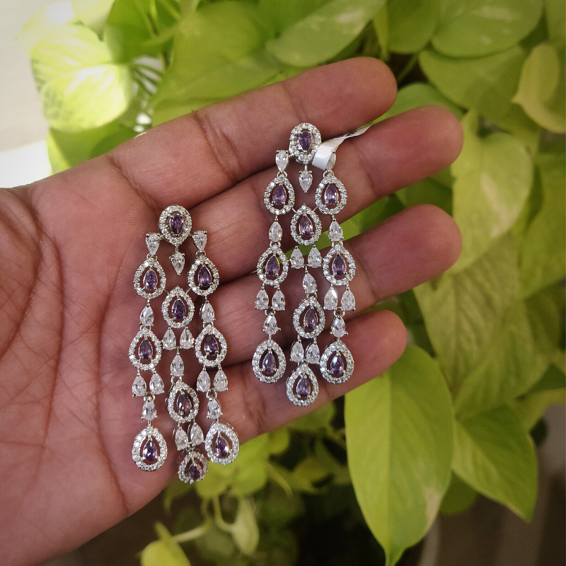 Amyra purple AD earrings detail
