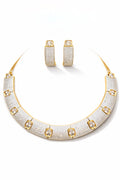Golden Collar necklace set on light background